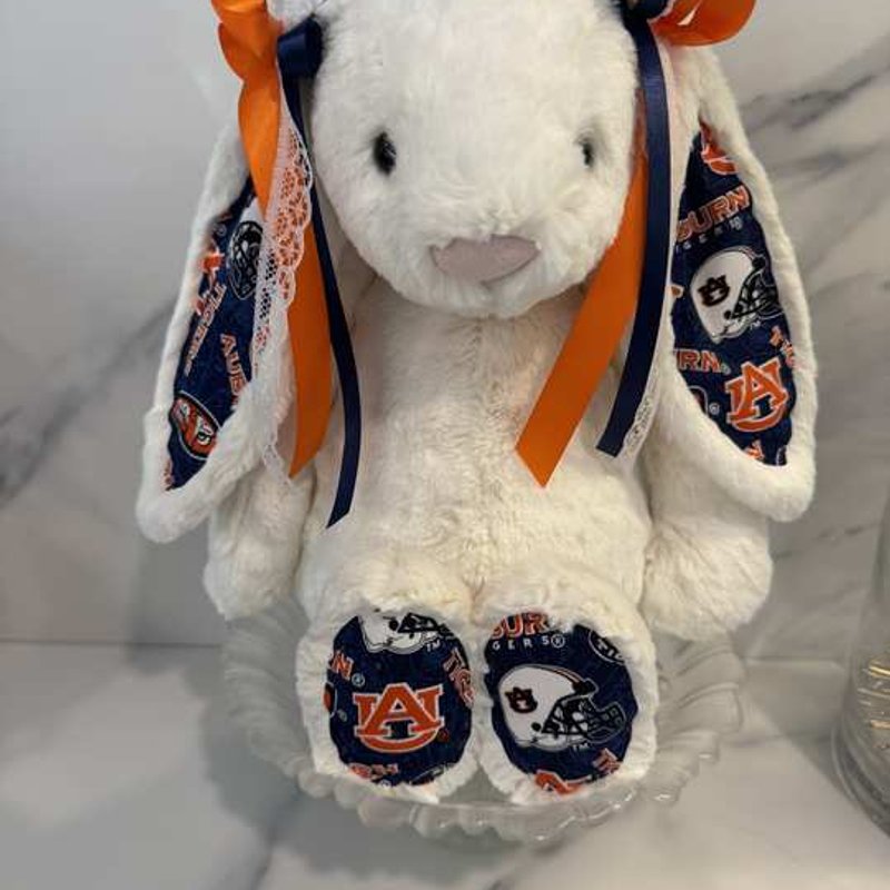 Auburn Bunny, front view — plush rabbit trimmed in navy and orange